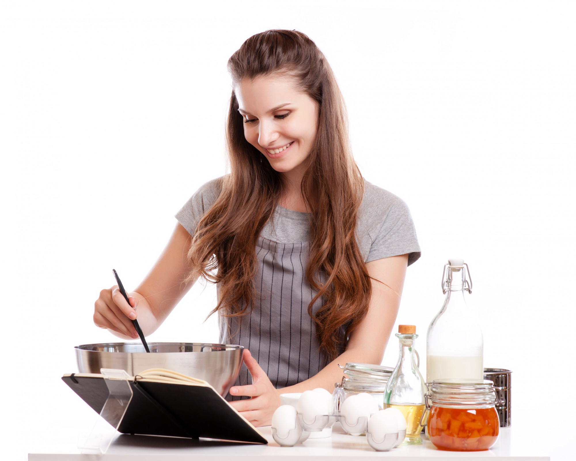 Student plating food in a small kitchen